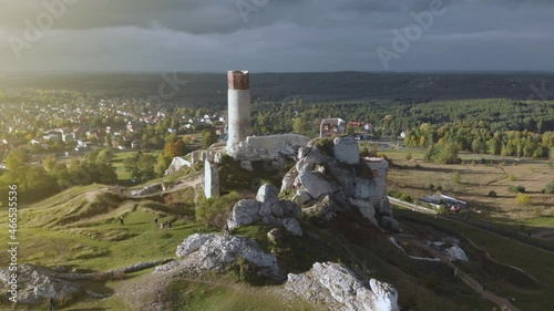 Incredible ruins of Olsztyn Castle (Silesian Voivodeship) fortification in the middle of nature in Poland at sunset, situated on the route of eagles' nests. Jura Park, gothic architecture. Aerial 4k
