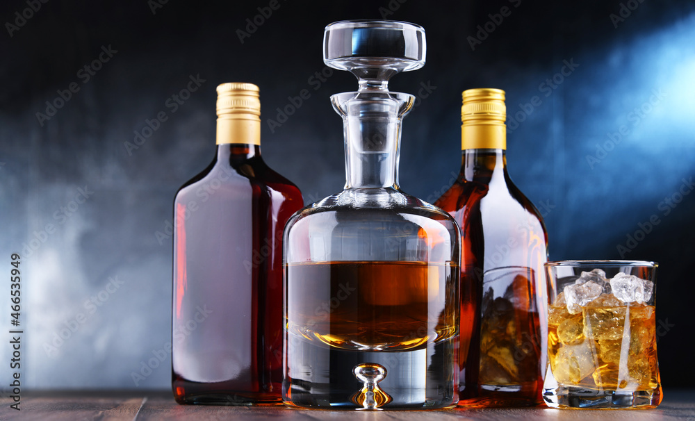 Bottles of assorted alcoholic beverages. Bottles of assorted alcoholic beverages.
