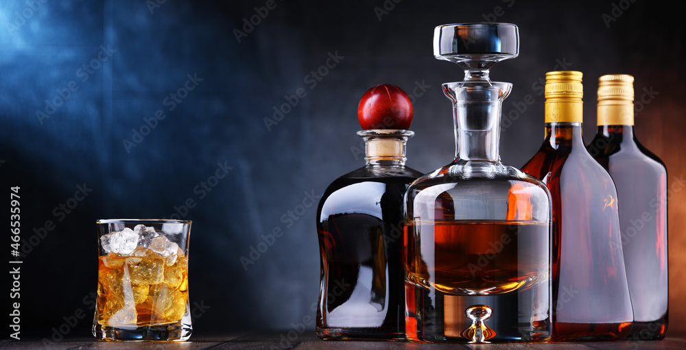 Bottles of assorted alcoholic beverages. Bottles of assorted alcoholic beverages.