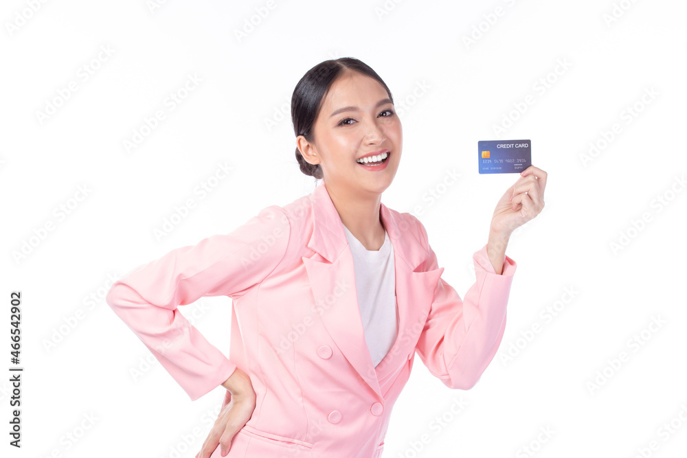 Portrait of a happy young asian woman wearing pink suit holding bank card, credit card isolated on white background. Business online shopping concept. Portrait of a happy young asian woman wearing pink suit holding bank card, credit card isolated on white background. Business online shopping concept.