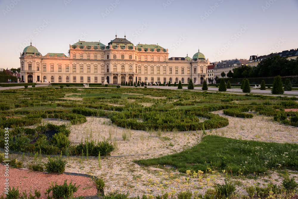 Famous Belvedere castle (Schloss Belvedere) surrounded by gardens with classic statues, Vienna, Austria