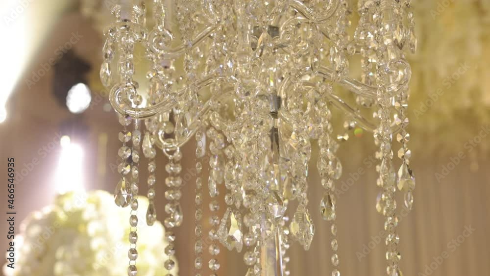 Beautiful Chandelier In Restaurant. Many Transparent Particles On Chandelier Of Different Lengths. Beautiful Chandelier In Restaurant. Many Transparent Particles On Chandelier Of Different Lengths.