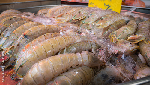 Seafood at the fresh market, shrimp types are called Mantis shrimps, Stomatopods are peeled and stacked in ice. to wait for the kilo to sell at the seafood market