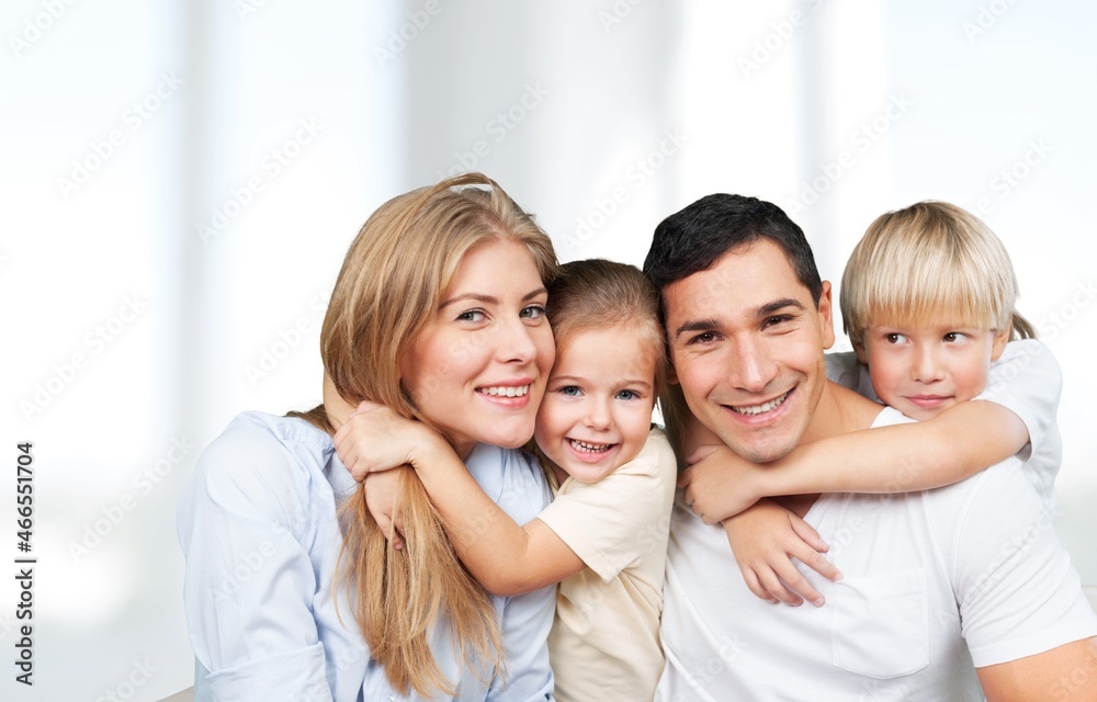 Portraif Of Happy Parents Posing With Their Little children At Home Portraif Of Happy Parents Posing With Their Little children At Home