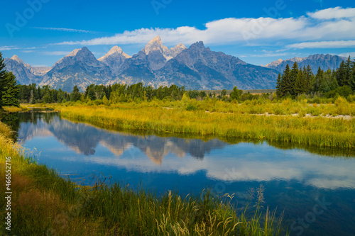 beautiful reflection of the Grand Teton Mountain Range in the water near Schwabacher Landing on the Snake River in Wyoming  © vermontalm