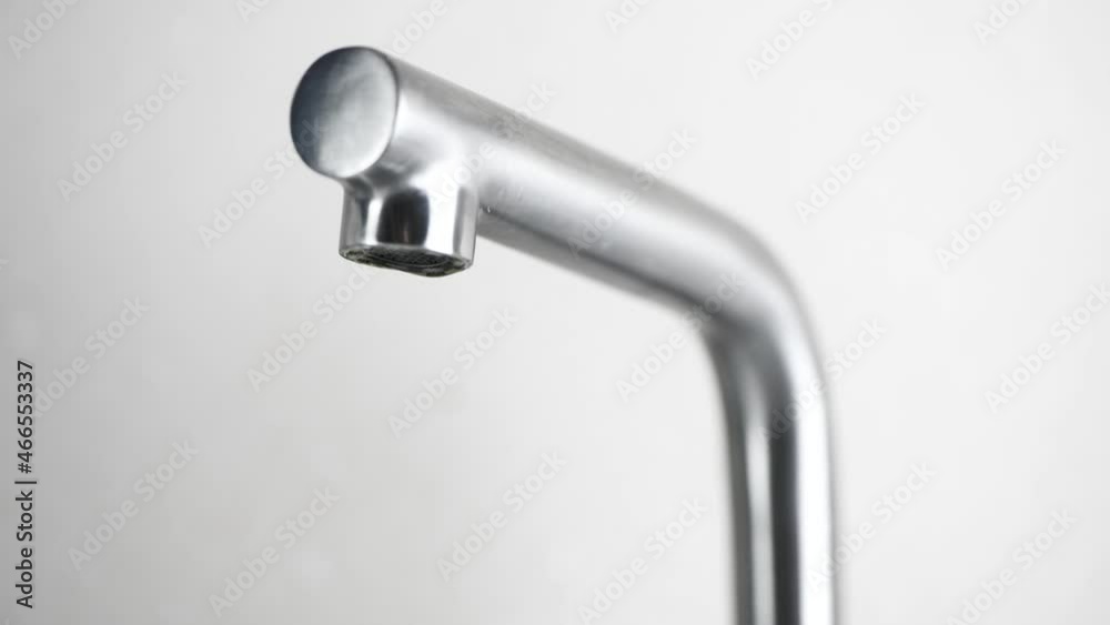 water drips from a faucet. Water leakage water drips from a faucet. Water leakage
