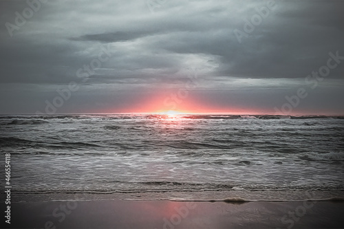Cloudy landscape at the atlantic ocean in france at the sunset