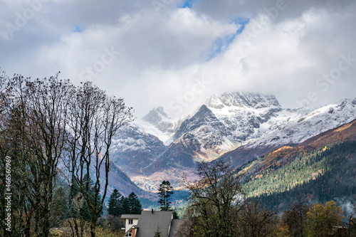 landscape, nature, gorge, mountains, rocks, snowy peaks, forest, trees, fir trees, house, space, distance, height, sky, clouds, fog, haze, autumn, october, sun glare, shadow, light, travel, beauty