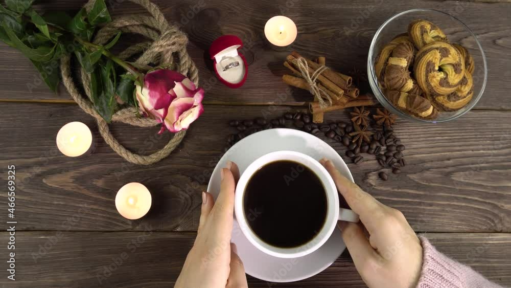 Female hands on a white cup of coffee. Female hands on a white cup of coffee.