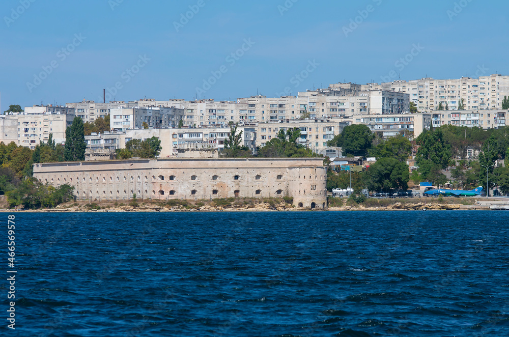 View of the Mikhailovsky ravelin in the bay of Sevastopol and the houses of the northern side of the city.