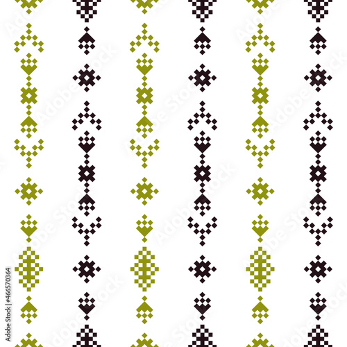 Geometric seamless pattern of green and black squares in a flat style ornament in the form of pixels. Embroidery dotted schemes. Textile geo prints. Pixel navajo backgrounds.
