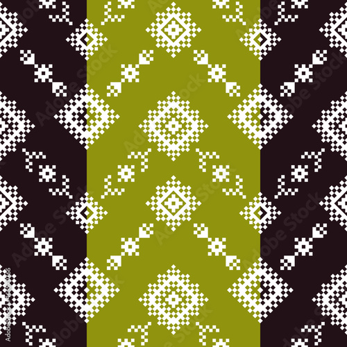 Geometric seamless pattern of green and black squares in a flat style ornament in the form of pixels. Embroidery dotted schemes. Textile geo prints. Pixel navajo backgrounds.