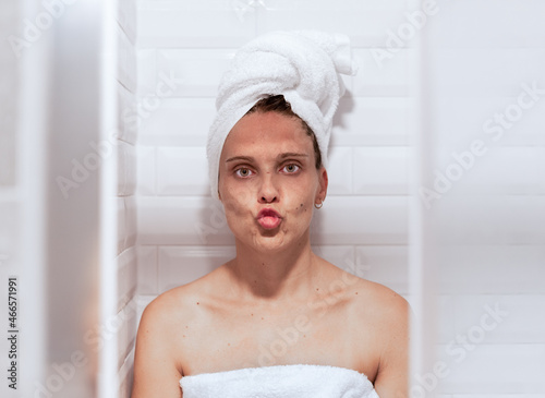 Photography Woman after taking a shower, puckering her lips to kiss