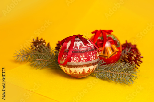 red christmas balls on a yellow background