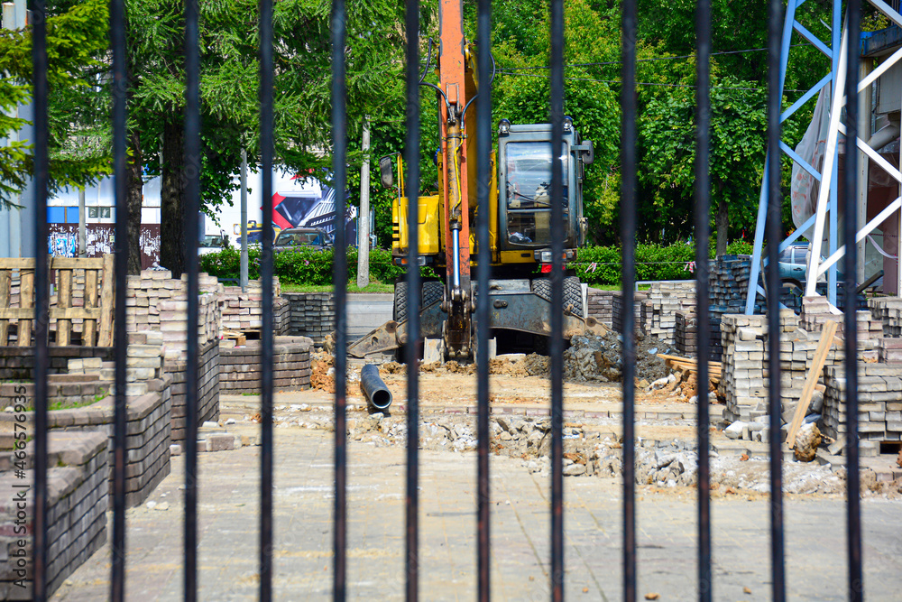Construction site with appliances behind a fence. The concept of restrictions on construction objects. Construction site with appliances behind a fence. The concept of restrictions on construction objects.