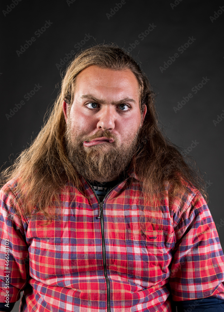 Man making silly face in studio Man making silly face in studio