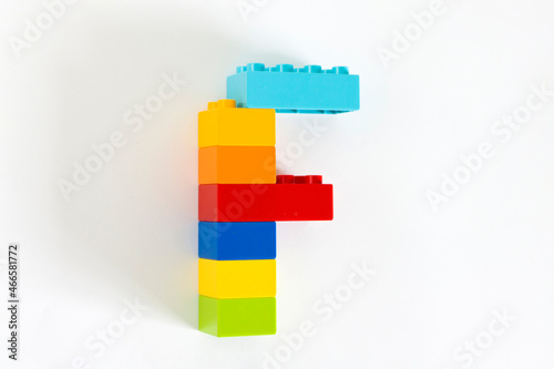 Colorful toy brick letter F