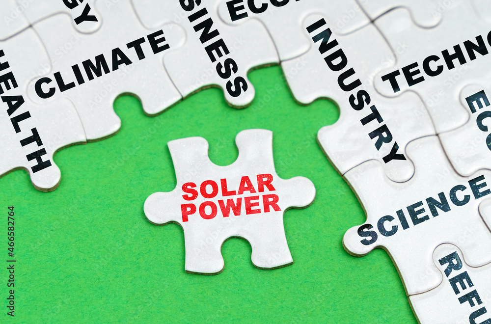 On a green background, white puzzles with text, a puzzle with the inscription - Solar Power On a green background, white puzzles with text, a puzzle with the inscription - Solar Power