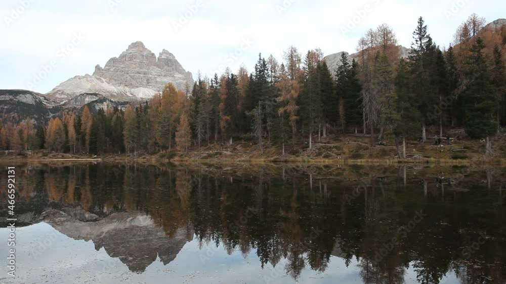 Autumn panorama of Lake d'Antorno with the Tre Cime di Lavaredo in the background. High quality FHD footage. Beautiful autumn scenery. Popular and famous travel destination Autumn panorama of Lake d'Antorno with the Tre Cime di Lavaredo in the background. High quality FHD footage. Beautiful autumn scenery. Popular and famous travel destination