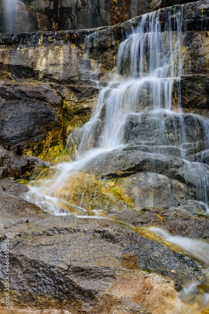 Naklejka premium Beautiful waterfall on small river in a park