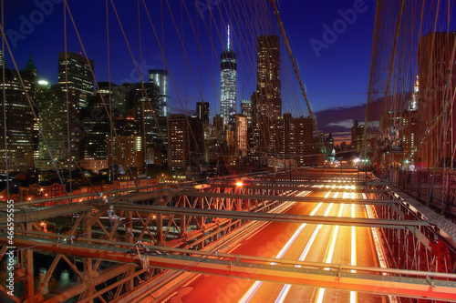 Brooklyn Bridge in New York (USA) during night with view of Manhattan and car's lights  © marekfromrzeszow