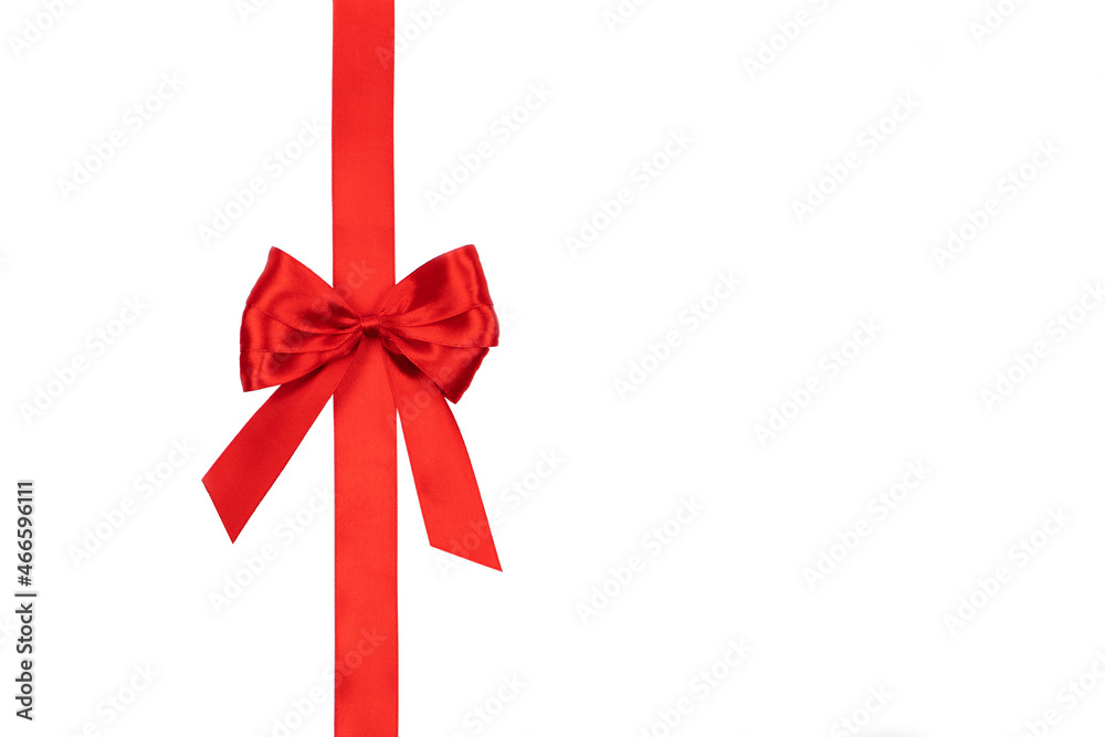 Red satin ribbon bow tied isolated on a white background with copy space. Present time. Red satin ribbon bow tied isolated on a white background with copy space. Present time.