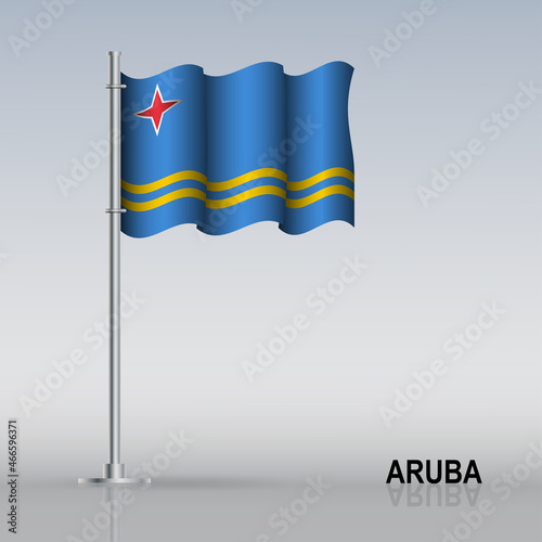 Flag of Aruba flying on a flagpole stands on the table