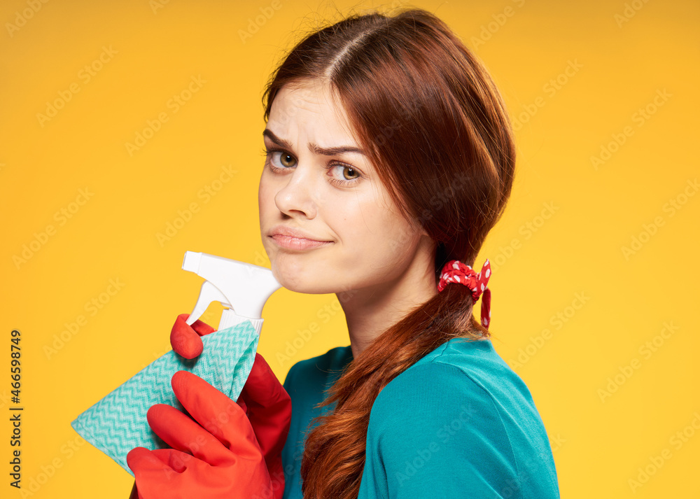 woman in rubber gloves detergent cleaning housework yellow background woman in rubber gloves detergent cleaning housework yellow background