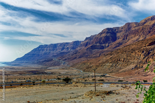 Landscape view along Dead Sea coast and Jordanian mountains in the distance, Israel. 