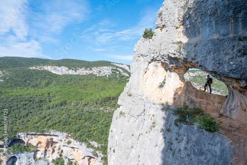 Mountaineer climbing a mountain wall