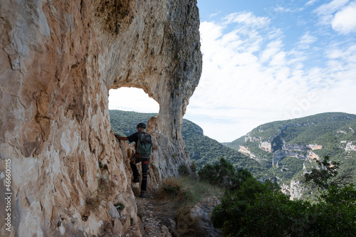 Mountaineer climbing a mountain wall photo