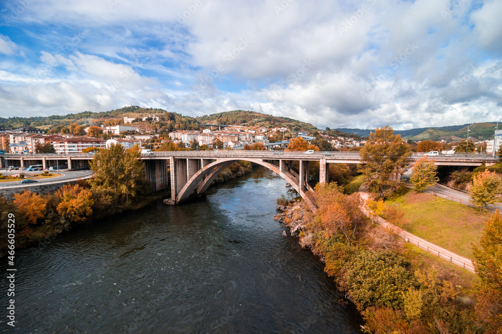Bridge over the Miño river in the autumn season, in Ourense, Galicia 
