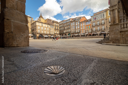 Urban landscape photography in Plaza Mayor, in Ourense, with the symbol of Santiago de Compostela walkers in the foreground