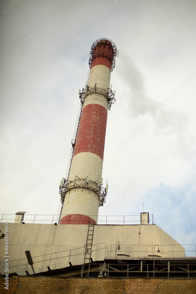 Boiler room pipe. Factory details. Red white pipe to remove heat and steam. High co-equipment. Details of industrial architecture. Boiler room pipe. Factory details. Red white pipe to remove heat and steam. High co-equipment. Details of industrial architecture.