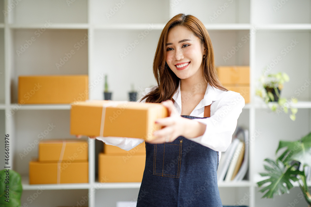 Portrait of Starting small businesses SME owners female entrepreneurs working on receipt box and check online orders to prepare to pack the boxes, sell to customers, SME business ideas online. Portrait of Starting small businesses SME owners female entrepreneurs working on receipt box and check online orders to prepare to pack the boxes, sell to customers, SME business ideas online.