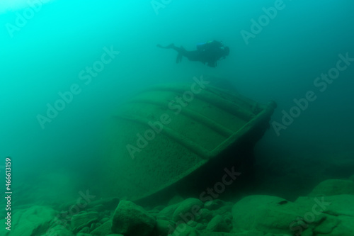 Diver exploring a Great Lakes tugboat shipwreck found in Lake Superior photo