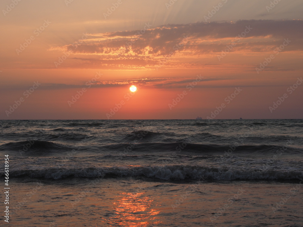 A sunset at a beach in Golem, Albania 