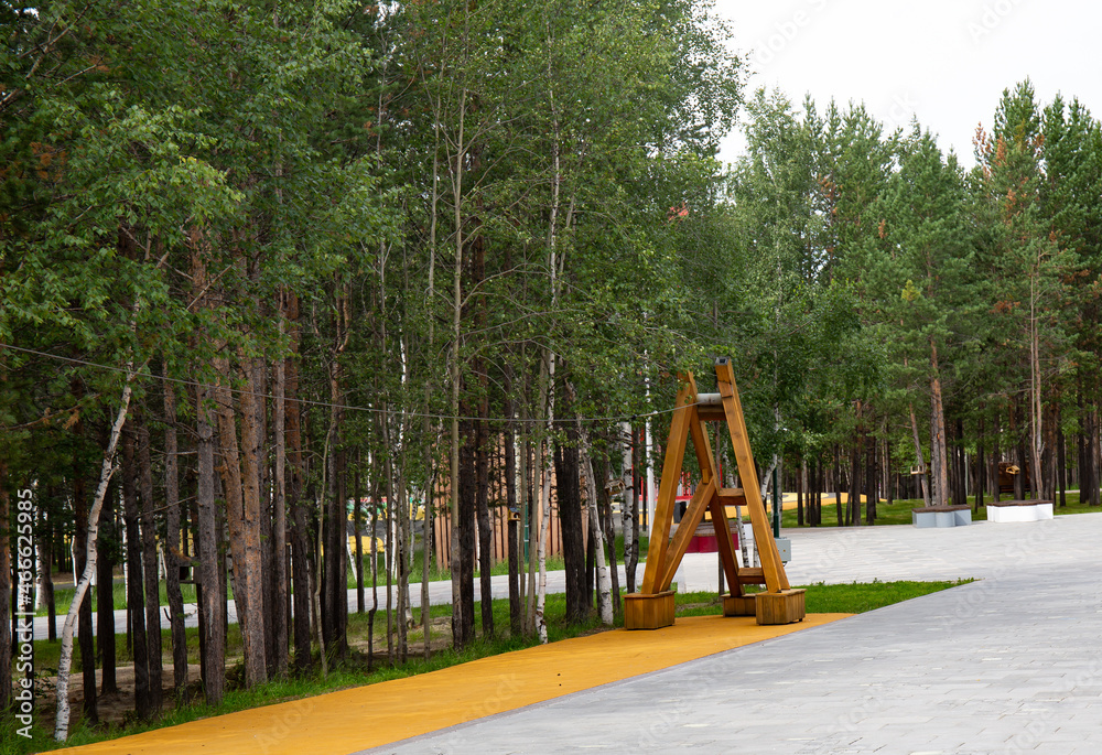 Original wooden structures in the central park of the city of Noyabrsk in summer Original wooden structures in the central park of the city of Noyabrsk in summer