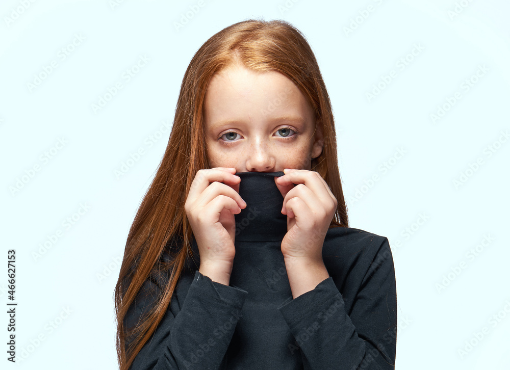 red-haired girl in a black sweater planning close-up red-haired girl in a black sweater planning close-up
