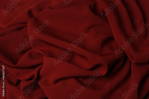 The texture of silk fabric burgundy color. Background, pattern. Luxury chiffon textile pattern. Luxurious valentines day background design