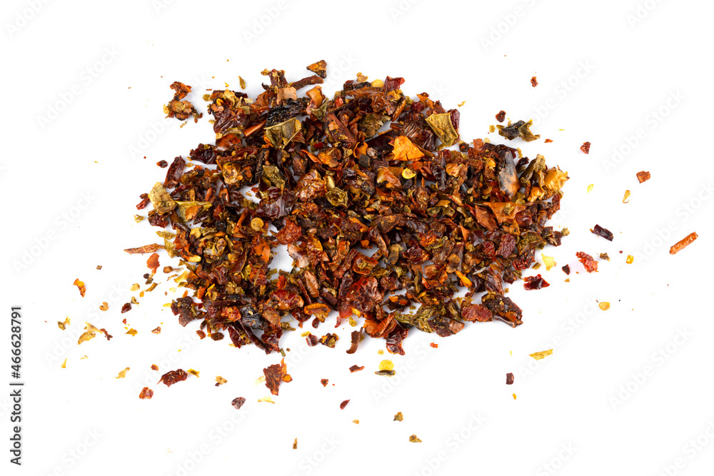 A mixture of seasonings scattered on a white background A mixture of seasonings scattered on a white background