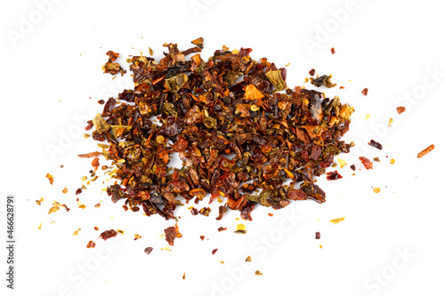 A mixture of seasonings scattered on a white background