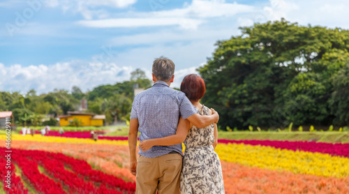 Photography Happy asian retired couple relaxed in flower garden