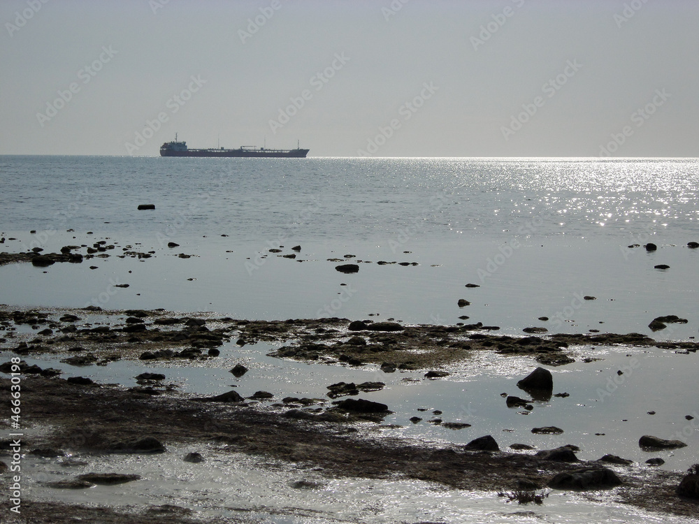 Silhouette of a ship at sea. Silhouette of a ship at sea.