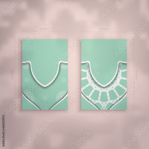 Mint color business card with Greek white pattern for your personality.