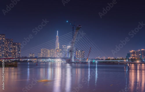 skyline with landmark 81 skyscraper  a new cable-stayed bridge is building connecting Thu Thiem peninsula and District 1 across the Saigon River.