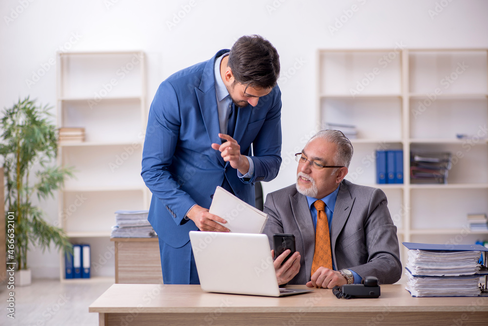 Two colleagues working in the office Two colleagues working in the office