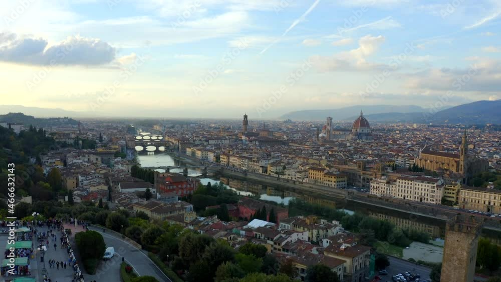 Florence, Tuscany, Italy, October 2021. Drone pushes west along the Arno river with Piazzale Michelangelo in the foreground. Florence, Tuscany, Italy, October 2021. Drone pushes west along the Arno river with Piazzale Michelangelo in the foreground.