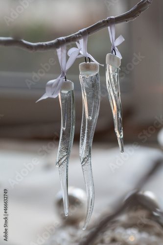 Dichroic glass icicles hanging on a branch, handmade in fusing technique, beautiful christmas decor