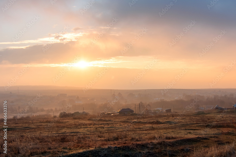 beautiful sunrise nature landscape. rural meadow at sunset with sun and mist - panorama nature sunrise with dramatic clouds sky. Calm of country meadow sunrise landscape background